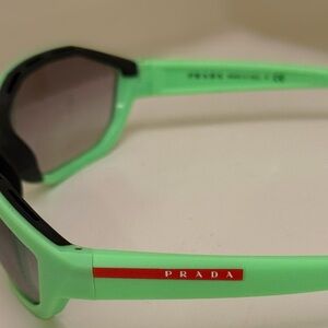 Brand New, With Tags, Prada Linea Rossa PS 10US model, neon green sunglasses.